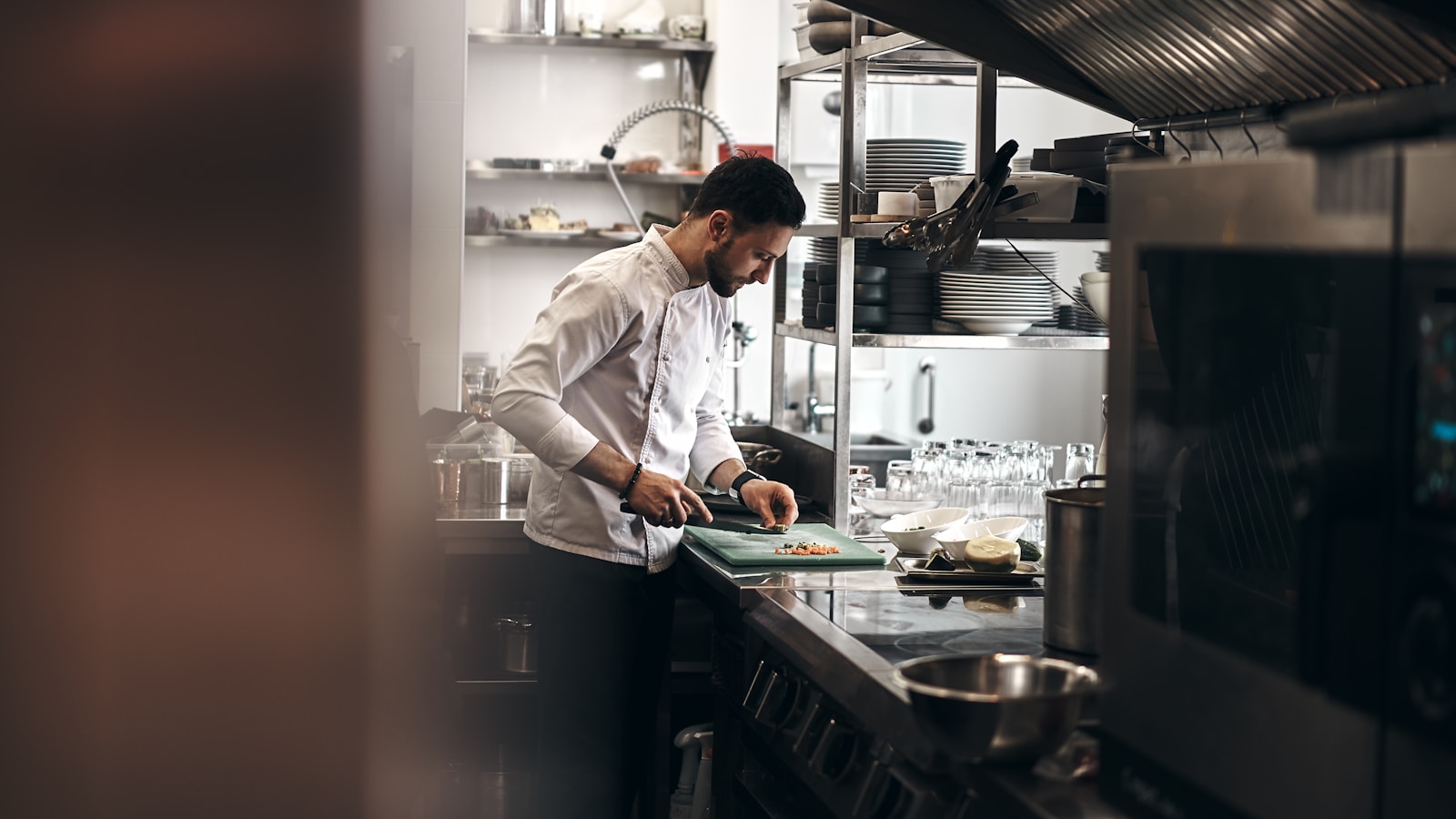 man in white dress shirt holding white ceramic plate, business
